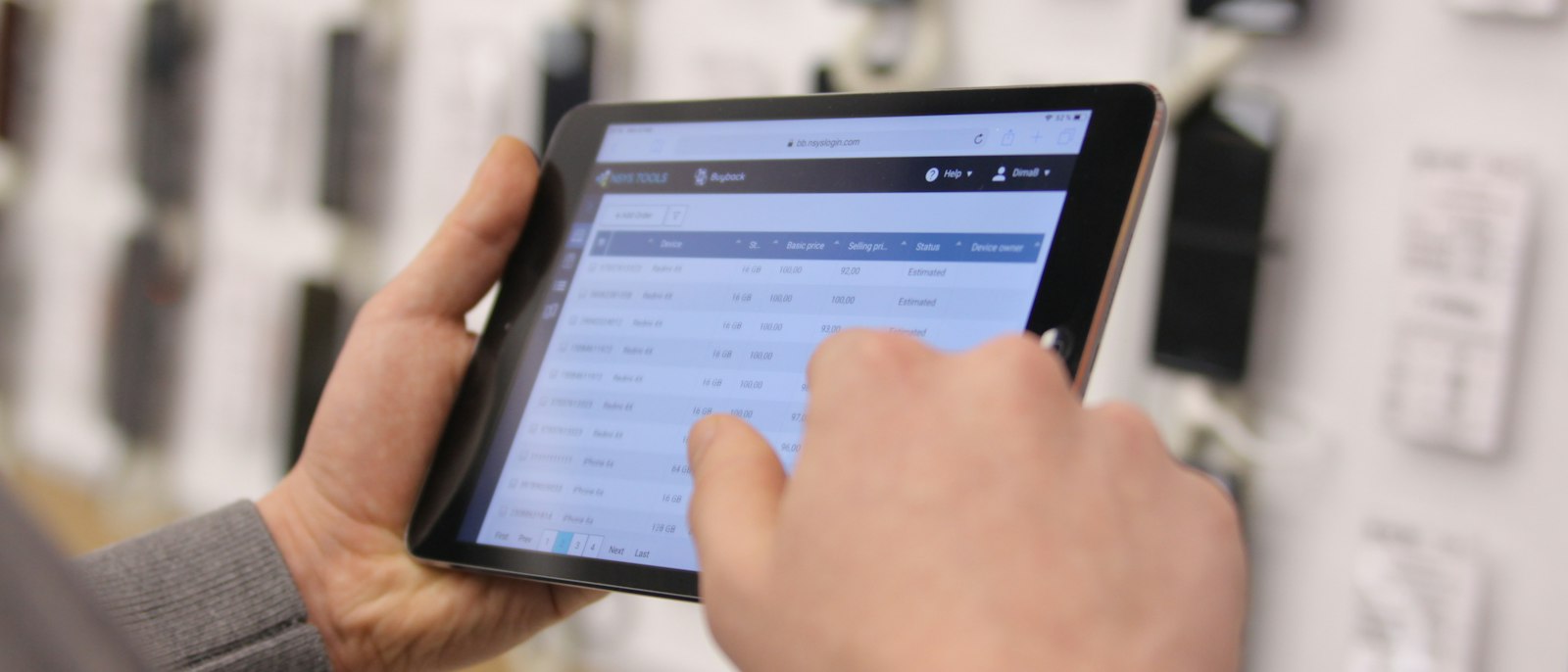 Taking an order on a tablet in a warehouse aisle